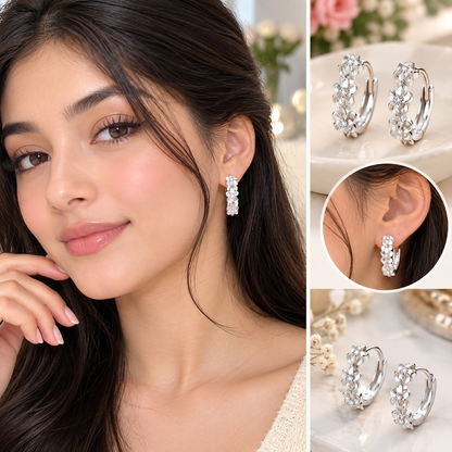 A collage showing a woman wearing silver hoop earrings with clear crystal-like floral clusters. The left panel is a close-up portrait of the model wearing one earring, while the right side shows additional product views of the earrings on a light surface.