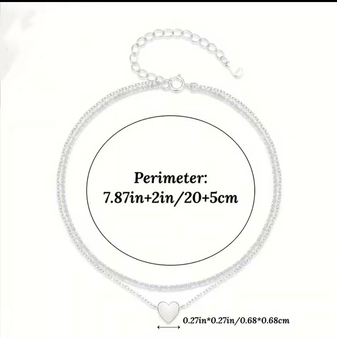 Silver chain necklace with a small heart pendant, shown with a measurement circle and text indicating a perimeter of 7.87 inches plus 2 inches extender and 5 cm, plus a heart length of 0.