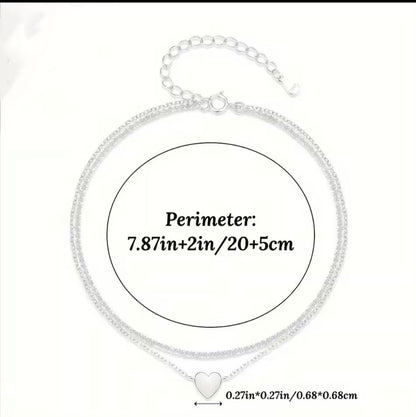 Silver chain necklace with a small heart pendant, shown with a measurement circle and text indicating a perimeter of 7.87 inches plus 2 inches extender and 5 cm, plus a heart length of 0.